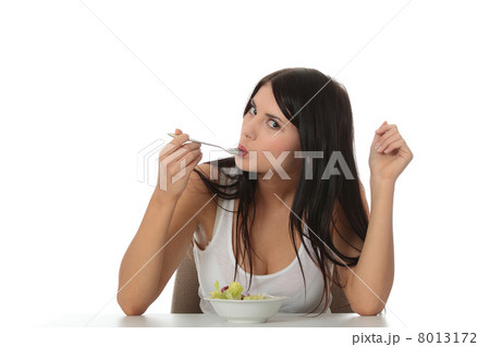 Girl eating salad 8013172