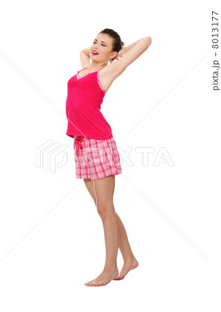 Young teen woman in pink pajamas 8013177