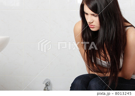Beautiful woman having a stomachache 8013245