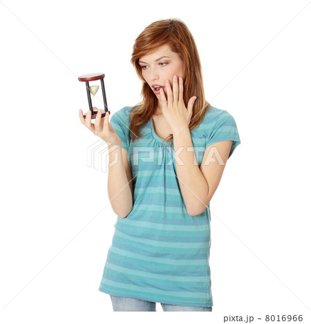 Teen woman holding hourglass 8016966