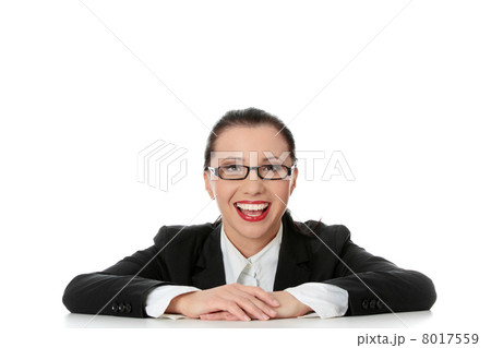 Young happy businesswoman behind the desk Young happy businesswoman behind the desk 8017559