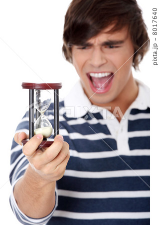 Young man with hourglass. 8017640