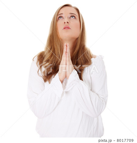 Closeup portrait of a young caucasian woman praying 8017709