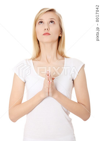 Young caucasian woman praying 8017842