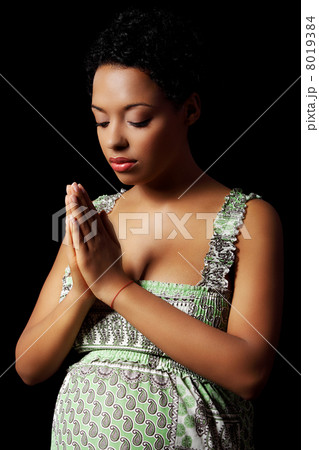 Young pregnant woman praying Young pregnant woman praying 8019384