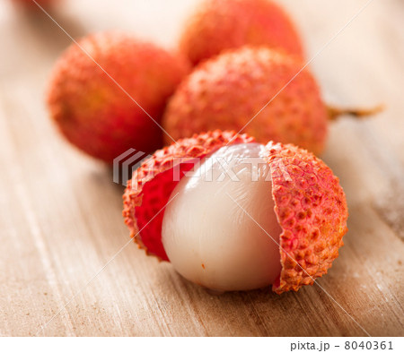 Lychee on a wooden table. Lichi Closeup. Selective focus 8040361