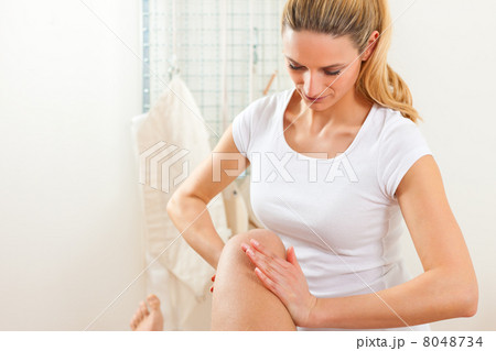Patient at the physiotherapy doing physical therapy 8048734