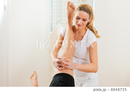 Patient at the physiotherapy doing physical therapy 8048735