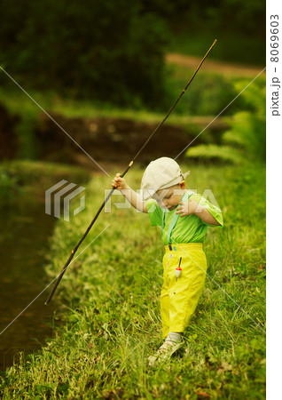 photo of little boy fishing 8069603