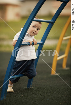 little boy plays on playground 8069734