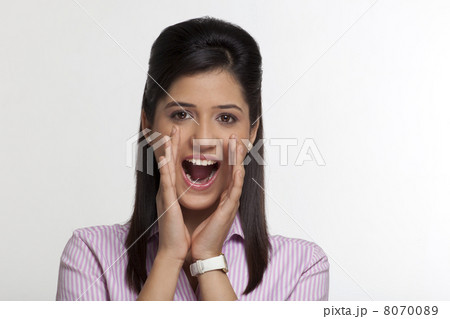 Portrait of female executive shouting 8070089