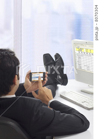 Businessman chatting on his phone 8070304