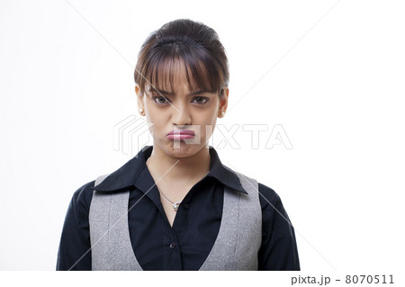 Portrait of sad young businesswoman over white background Portrait of sad young businesswoman over white background 8070511