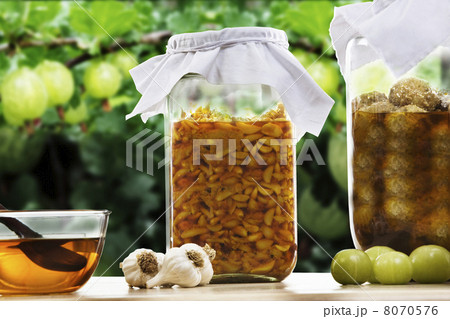 Jars filled with garlic and amla pickle 8070576