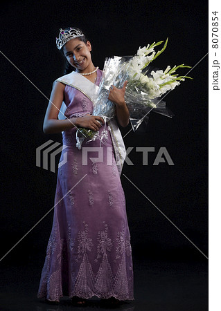 Teenage beauty queen with a bouquet 8070854