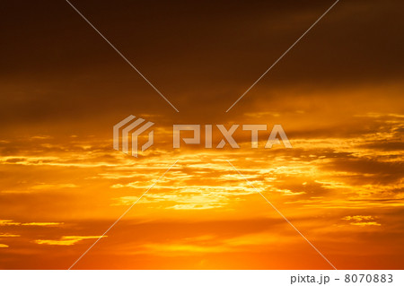 Bright vibrant orange and yellow colors sunset sky 8070883