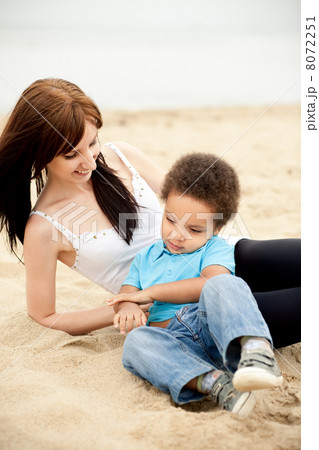 Multi-Ethnic family relaxing together outdoors 8072251
