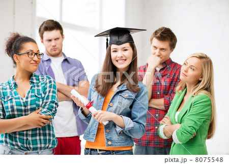 girl in graduation cap with certificate 8075548
