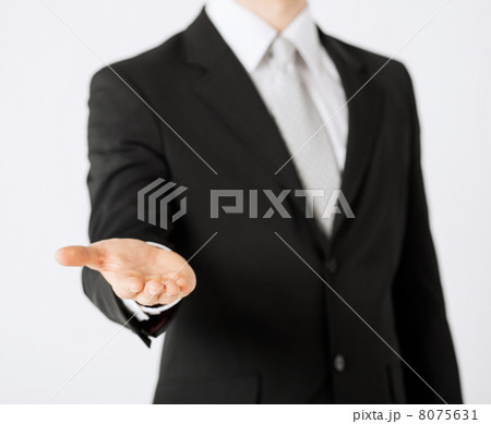 mans hand showing something 8075631