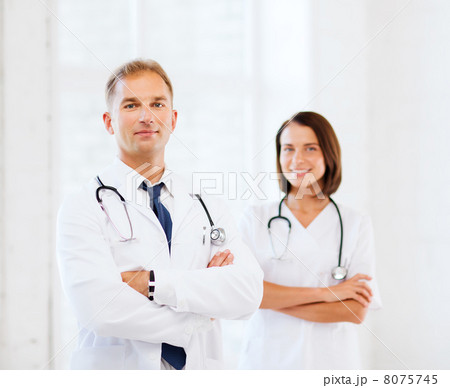 two doctors with stethoscopes two doctors with stethoscopes 8075745