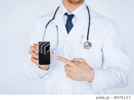 doctor pointing at smartphone doctor pointing at smartphone 8076127