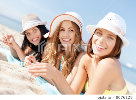 girls sunbathing on the beach girls sunbathing on the beach 8076129