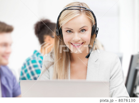 helpline operator with headphones in call centre 8076130
