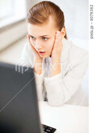 stressed businesswoman with computer 8076362