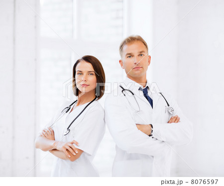 two doctors with stethoscopes two doctors with stethoscopes 8076597