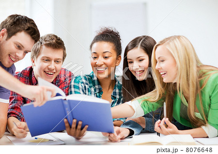 students reading book at school 8076648