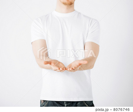 mans hands showing something 8076746