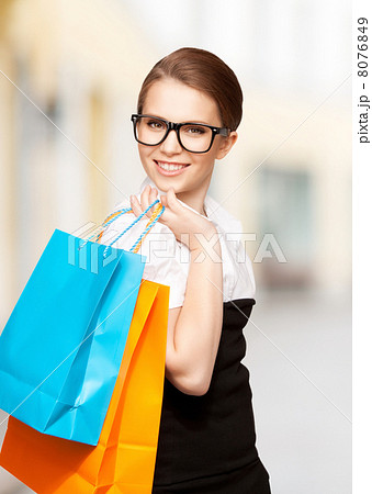 woman with shopping bags in ctiy 8076849
