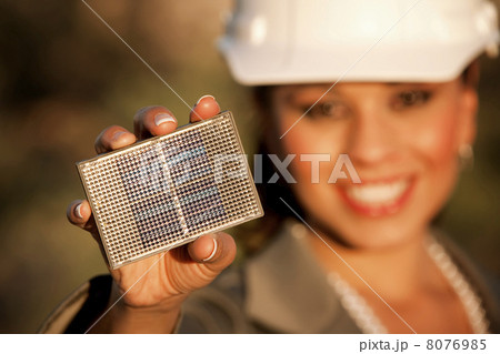 Pretty young woman with small solar panel Pretty young woman with small solar panel 8076985
