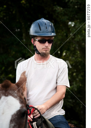 European or American man on horseback in Costa Rica 8077259