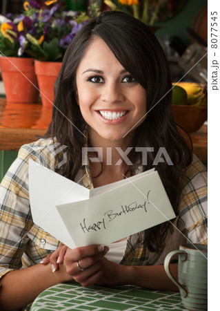 Beautiful Latina Woman with Birthday Card 8077545