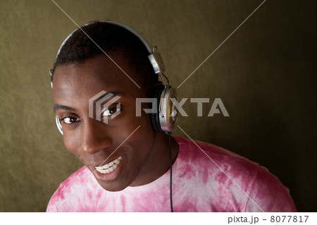 Smiling Man with Headphones Smiling Man with Headphones 8077817