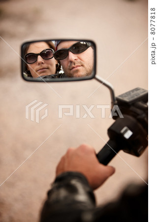 Motorcyclist and Woman Reflection Motorcyclist and Woman Reflection 8077818