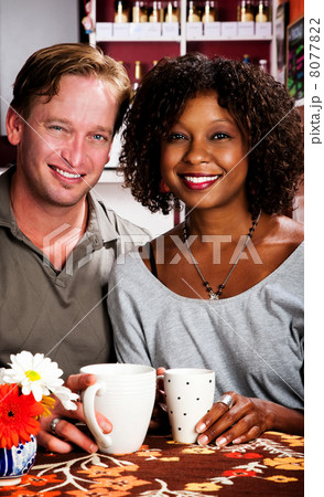Mixed race couple in coffee house 8077822