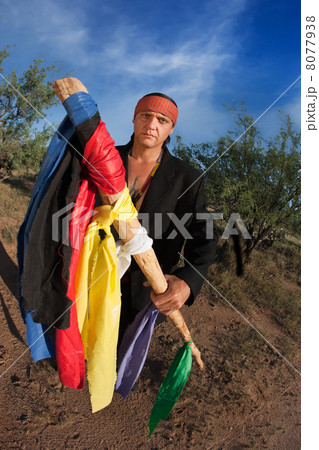 Native American man with colorful flags Native American man with colorful flags 8077938