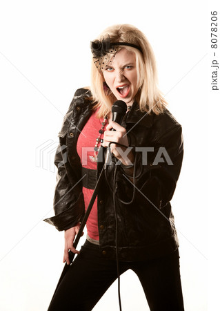 Pretty young singer or comedian with microphone 8078206