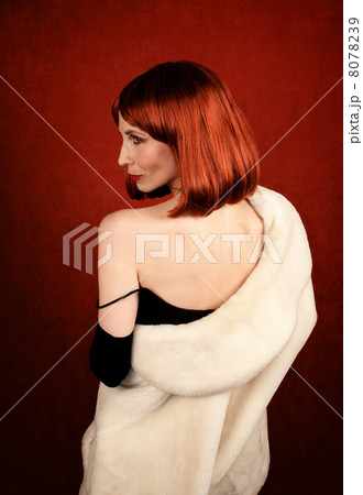 Socialite with brassy red hair 8078239