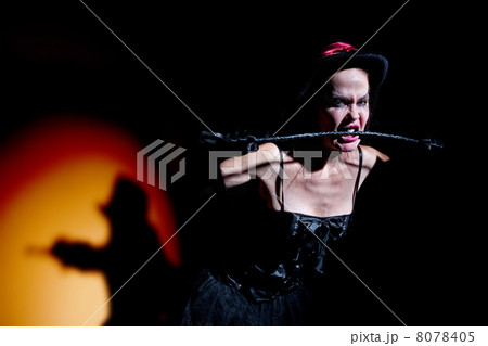 Lady in black carries whip Lady in black carries whip 8078405