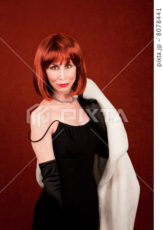 Socialite with brassy red hair 8078441