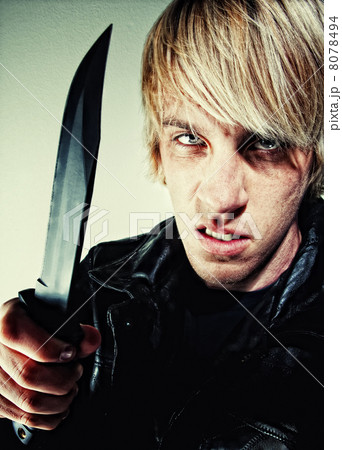 Young man with knife Young man with knife 8078494