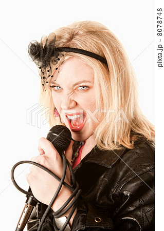 Pretty young singer or comedian with microphone 8078748