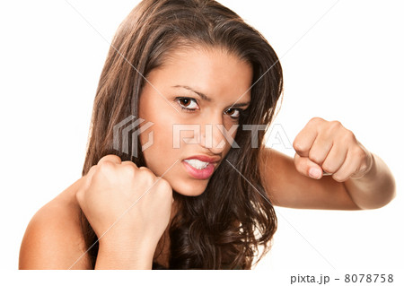 Pretty Hispanic Woman Throwing a Punch 8078758
