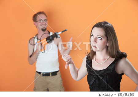 Woman Unhappy with Mans Work 8079269