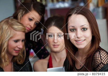 Cute Looking Girl with Friends in a Cafe Cute Looking Girl with Friends in a Cafe 8079435