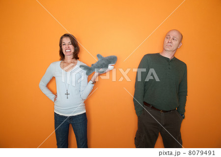 Woman Threatens Man with Toy Woman Threatens Man with Toy 8079491