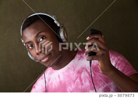 Serious Young Man with Headphones Serious Young Man with Headphones 8079873